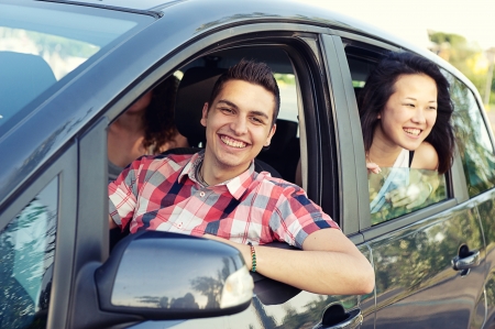 Boy and Girl in a Car Leaving for Vacationの写真素材