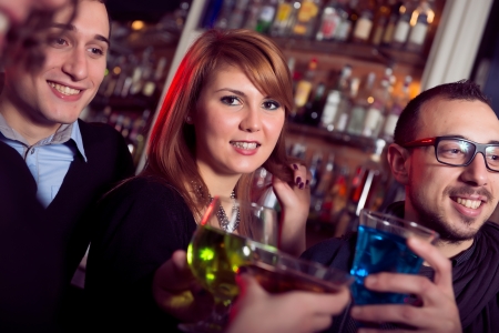 friends toasting at the disco,Italyの写真素材