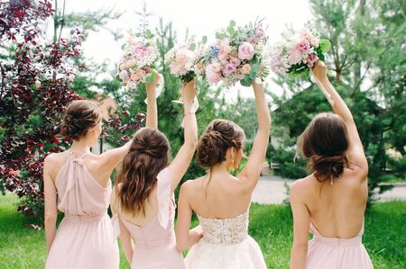 Bridesmaids Holding Wedding Bouquets Outdoor Happy Wedding Conceptの写真素材