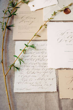 Handwriting letter, love message. Wedding vows, calligraphy cards and spring twigs, flat lay. Valentine's day inspiration. Declaration of love.の写真素材