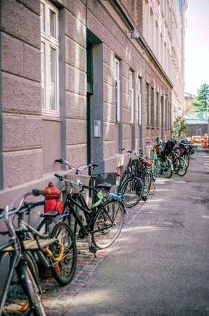 Row of parked colorful bikes on a street. Healthy lifestyleの写真素材