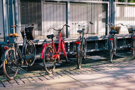 Many vintage bicycles parking at the street.の写真素材