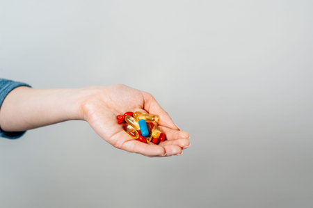 Woman's hand full of pills with copy space. World viral pandemic. Corona virus concept.