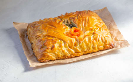 Tasty homemade salmon pie. Traditional Russian ciusine, fish pie made from yeast dough filled with salmon.の写真素材