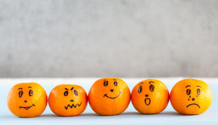 Mandarin emoji, tangerine with painted faces. Different emotions, characters: kind, angry, sad,...