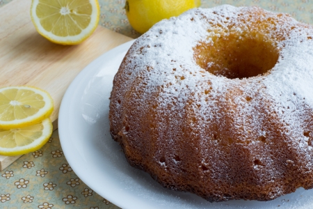 Sweet tasty lemon cake and sliced lemonの写真素材