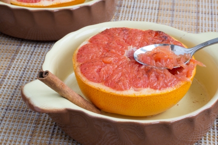 Healthy breakfast: grapefruit baked with sugar and cinnamon の写真素材