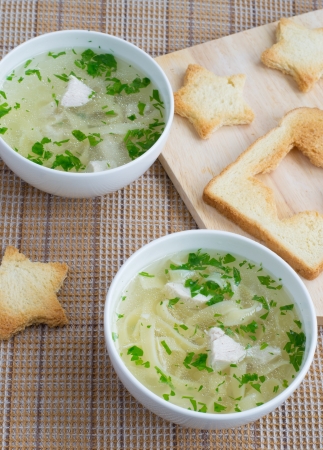 Tasty chicken soup and star toastsの写真素材