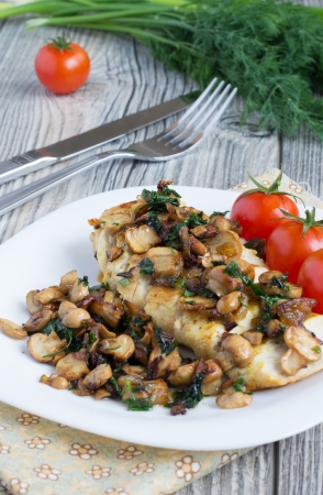 Grilled chicken breast with mushroomsの写真素材