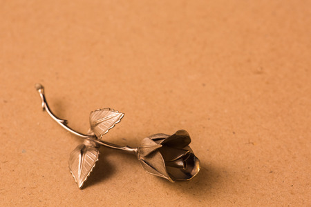 Metal rose on a background for holiday greetingsの写真素材