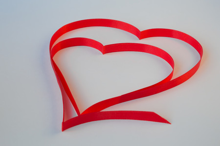 isolated heart of red ribbon on a white background for the  Valentine"s holidayの写真素材