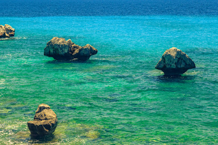 The rocky coast overlooking the turquoise blue sea in the warm summer day. Greece. Halkidikiの写真素材