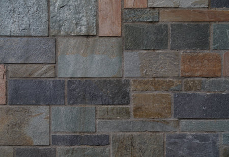 Background of processed geometric stones with different colors of warm and cold colors with clear...