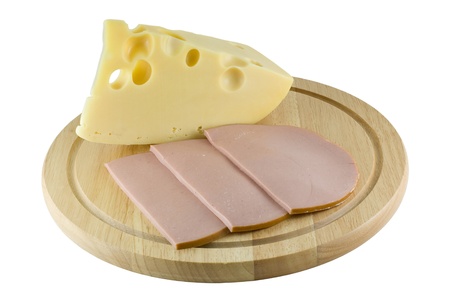 Piece of cheese and sausage on the board razelochnoyの写真素材
