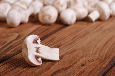 Sliced champignon on a wooden table の写真素材