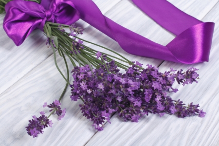 Bouquet of fresh lavender flowers with purple ribbonの写真素材