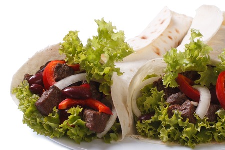 Two burritos with meat and vegetables isolated on a whiteの写真素材