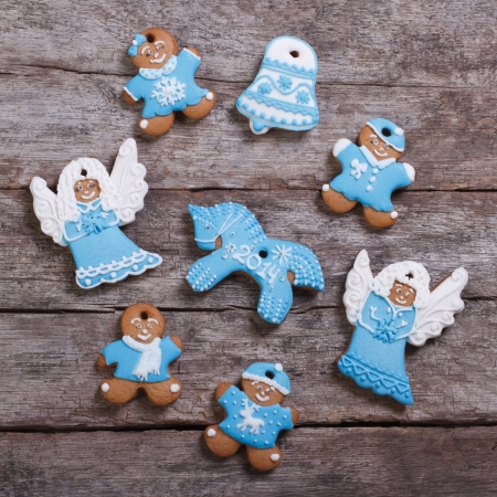 Festive gingerbread cookies on wooden table backgroundの写真素材