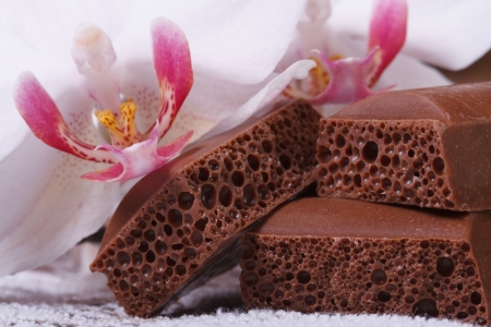 porous chocolate and white orchid flower macro horizontal. closeup の写真素材