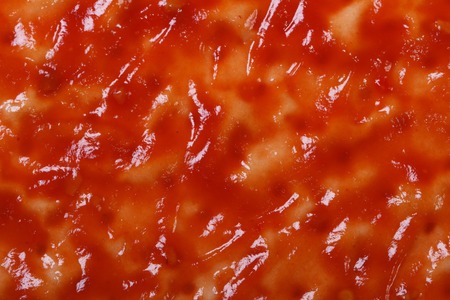 Base for pizza with tomato sauce close up. macro
の写真素材