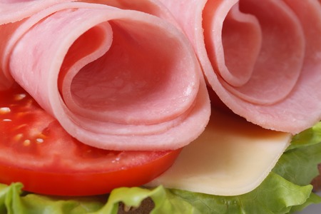 beautiful sandwich with ham and vegetables isolated on white background macro. horizontal 
の写真素材