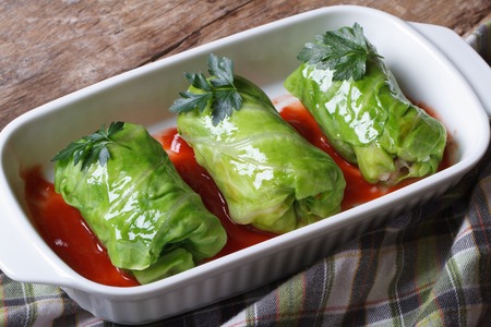 Rolls of young cabbage stuffed with rice and meat in tomato sauce closeup. top viewの写真素材