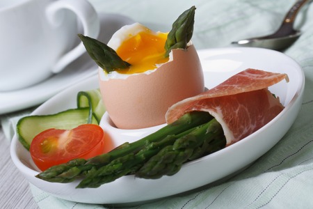 Boiled egg and green asparagus, ham and vegetables closeup. horizontal
の写真素材