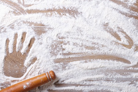 Imprint on female palm flour and rolling pin horizontal close-up
の写真素材
