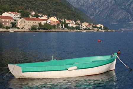 Green fishing boat in the Bay of Kotor near the village Stoliv in Montenegro.の写真素材