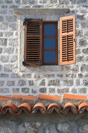 Old window with wooden shutters close up vertical. Mediterraneanの写真素材