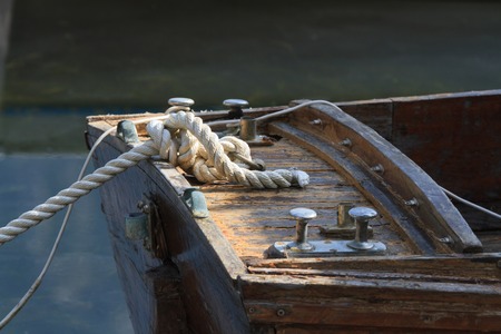 knot closeup of an old wooden boat mooredの写真素材
