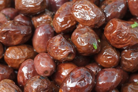 dark olives in oil close up. backgroundの写真素材