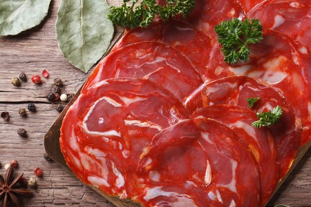 Chopped chorizo sausage close up on the table. horizontal top viewの写真素材