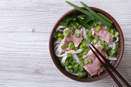 Vietnamese Pho Bo soup with beef and rice noodles close up. top view of a horizontalの写真素材