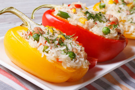 Delicious peppers filled with rice, vegetables and meat close up on a plate. horizontalの写真素材
