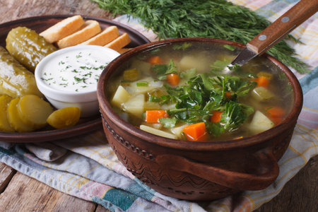 Polish cucumber soup in a bowl on the table close-up. horizontalの写真素材