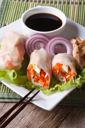 spring rolls with chicken and vegetables on a plate close-up. Verticalの写真素材