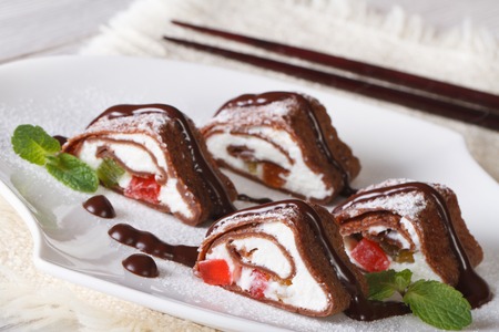 Asian chocolate roll with cheese and fruit on a plate. horizontalの写真素材