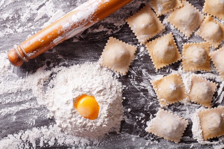 Italian ravioli with raw ingredients on the table. horizontal view from aboveの写真素材