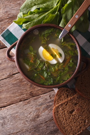 sorrel soup close-up on the table. vertical view above, rustic styleの写真素材