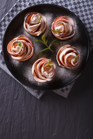 Beautiful food: apple dessert in the form of roses. vertical top viewの写真素材