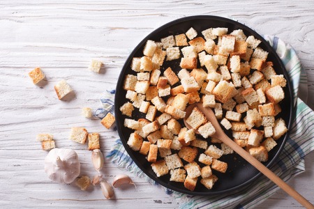 Homemade croutons in a bowl on the tableの写真素材