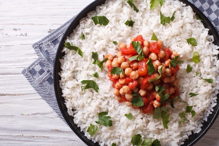 Rice with chickpea and parsley on the plate closeup. horizontal view from aboveの写真素材
