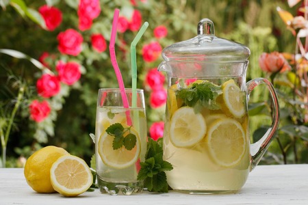 homemade lemonade in a glass close-up on the table. horizontal, outdoorsの写真素材
