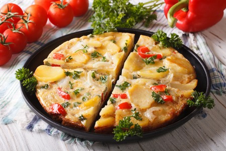 Chopped Spanish omelette with potatoes and vegetables close-up. horizontalの写真素材