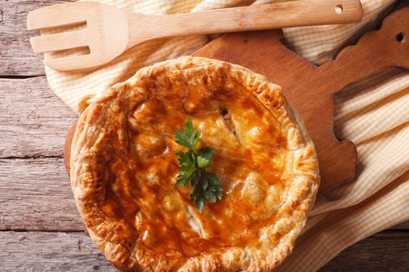 Delicious hot chicken pie close-up on the table. horizontal top viewの写真素材