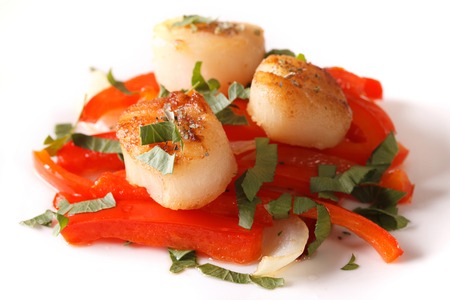 fried scallops with red pepper and parsley close-up on a plate. Horizontalの写真素材