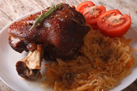 Delicious Baked pork shank and sauerkraut closeup on a plate. horizontalの写真素材
