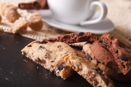 Cookies with chocolate chips and a cup of coffee close-up on the table. horizontalの写真素材