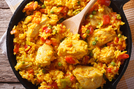 Hispanic cuisine: Arroz con pollo close up in a frying pan on the table. horizontal top viewの写真素材